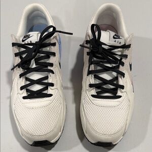 Nike Air Max women’s White Sneakers with Black, Pink and Blue Accents.